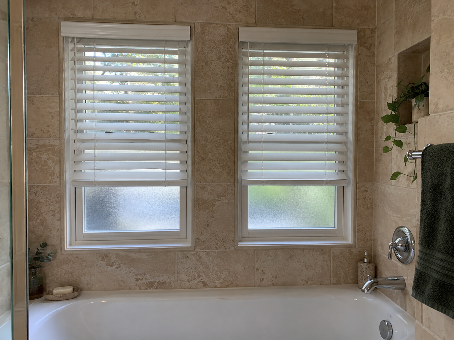 Illustration of white faux wood blinds over two bathroom windows